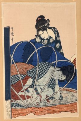 an image of a woman in a blue kimono sitting on a bed next to a cat
