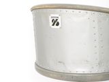 a small metal pot sitting on top of a metal stand