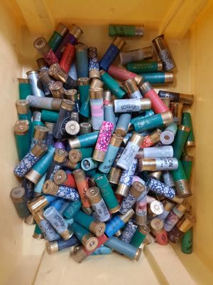 a yellow box filled with lots of different colored cans