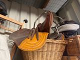 a wicker basket with a pair of shoes on top of it
