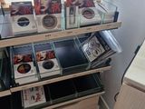 a lot of cds on the shelves in the store