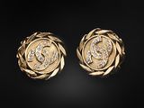 a pair of gold earrings with diamonds on a black background
