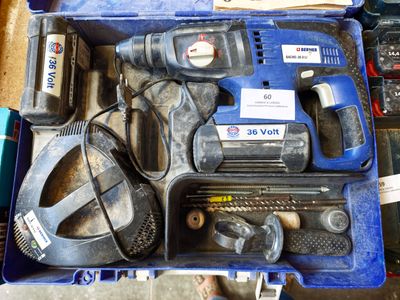 a blue tool case with tools in it on a table