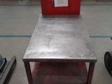 a metal table with a red box on top of it
