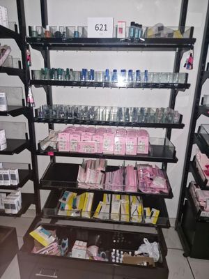 a shelf with many different items on it in a store