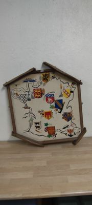 a clock that is sitting on top of a wooden table