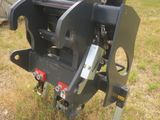 a machine that is sitting on the grass in the field