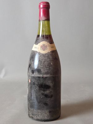a bottle of wine that is sitting on a table
