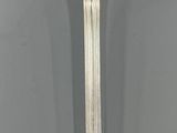 a silver spoon that is sitting on a table