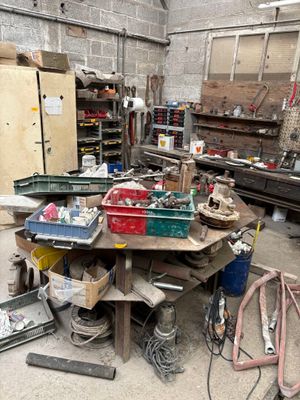 a workbench with many tools on it in a garage