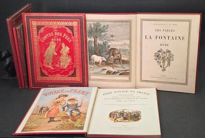 Trois livres de littérature enfantine française sont posés sur une table