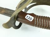 a close up of a knife with a tag on it