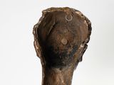 pair of bronze sculptures of a woman ' s head and a man ' s head