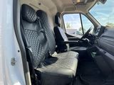 a white van with black seats in the back of it
