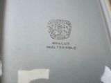 a close up of a vase with a stamp on it