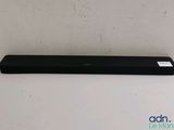 a close up of a black sound bar on a white surface