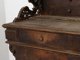 a wooden dresser with drawers and a mirror on top of it
