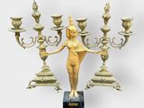 an image of a statue of a woman holding a candelabra