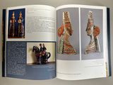 a book with a picture of a couple of figurines on it