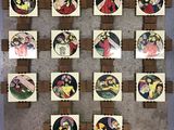 wooden pegs with pictures of people on them hanging on a wall
