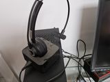 a laptop and headphones sitting on a desk next to a monitor