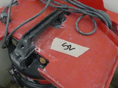 a picture of a red machine with a number on it