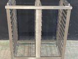 a metal rack that has a bunch of trays in it