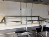 a kitchen with two sinks and a metal counter top