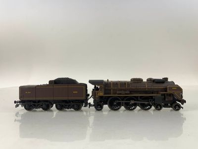 a toy train that is sitting on a white surface