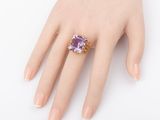 an image of a woman ' s hand with a ring on it ' s finger