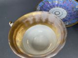 two bowls sitting next to each other on a table