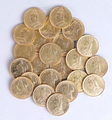 a pile of gold coins sitting on a white surface