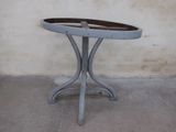 a small table with a wooden tray on top of it