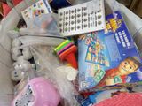 a basket filled with toys and a remote control