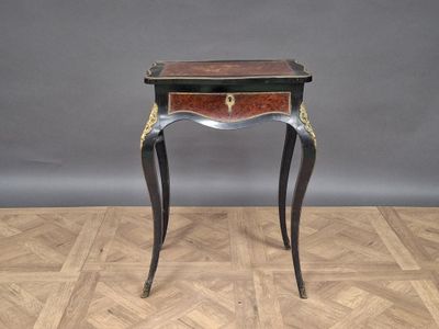 an image of a small table with a drawer on top of it