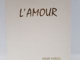a white box with a brown writing on it that says l ' amour
