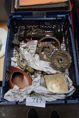 a basket full of antique items on a table