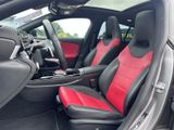 the interior of a car with red and black leather seats