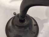 a black faucet on a white table with a black handle