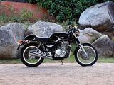 a motorcycle that is parked on the side of the road