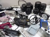 many different types of electronic devices on a table