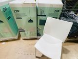 three boxes and a chair sitting on the floor