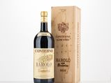 a bottle of wine sitting next to a wooden box