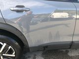 a reflection of a man in a car ' s side mirror
