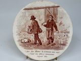 a plate with a picture of a man and a woman on it