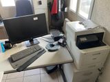 a desk with a computer and a printer on it