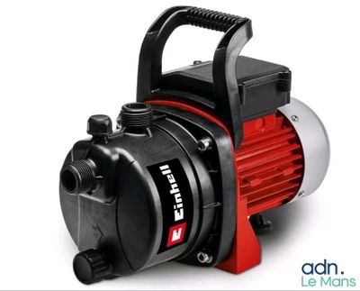 a close up of a red and black pump on a white background