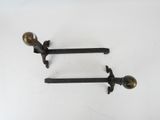 pair of antique cast iron door handles with brass knobs