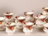 a picture of a table setting with a bunch of cups and saucers