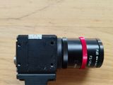 an image of a camera lens on a wooden table